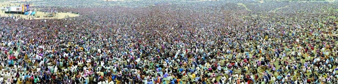 A panoramic crusade crowd stretching across the horizon