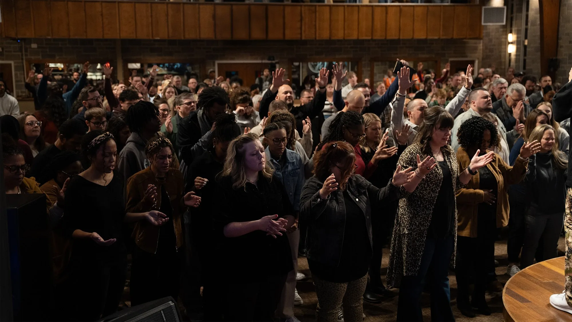 A congregation gathered in prayer