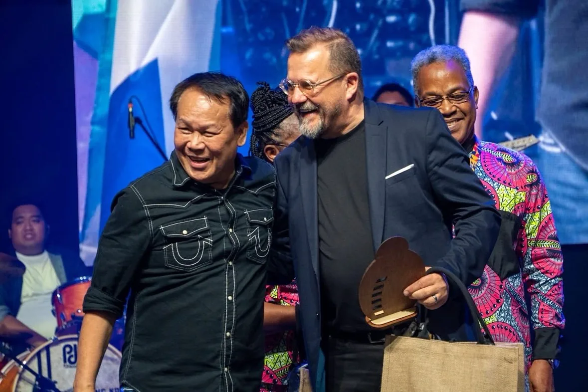 PCG Global Missions Director receiving an award on stage